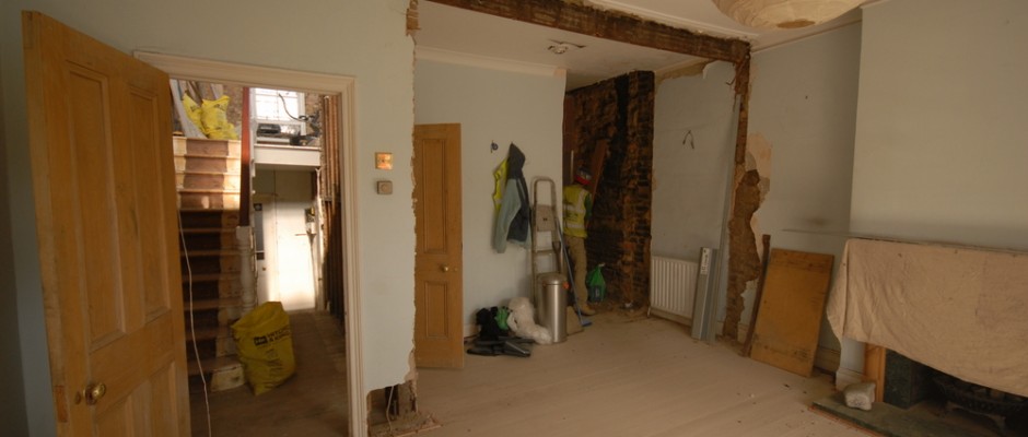 The living room where the arch and the chimney breast have been removed
