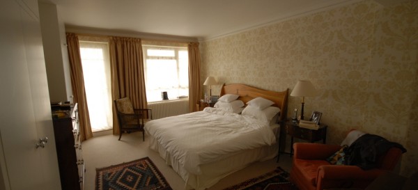 In the master bedroom - bespoke wardrobes were built and the walls were wallpapered.