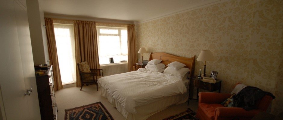 In the master bedroom - bespoke wardrobes were built and the walls were wallpapered.
