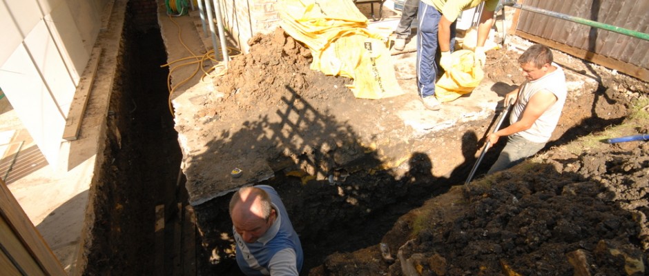 The team digging out the foundations by hand