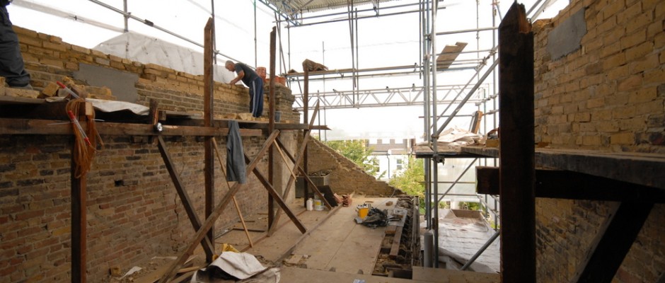working on the loft walls - note the scaffold made from the old joists!