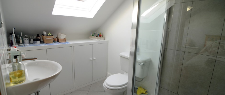 Loft shower room with cupboards