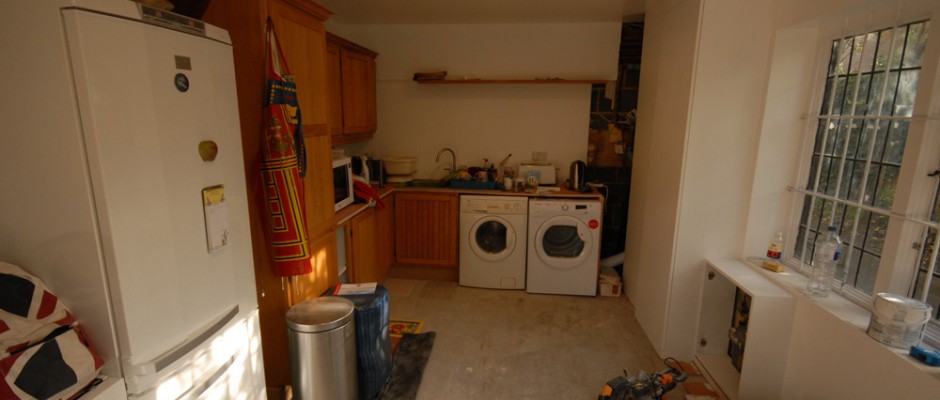 We used some of the old kitchen units and fitted them inside the garage to create a utility room