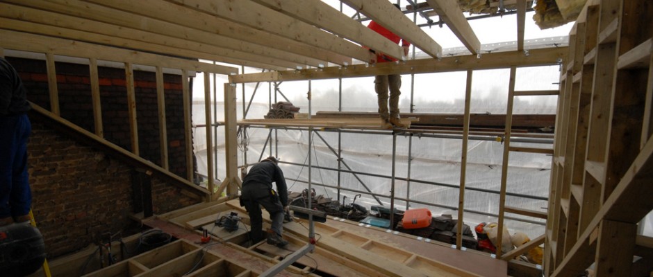 The wooden framework for the dormer is being put in place