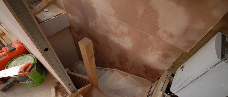 The new stairwell and the plaster is drying. (the boiler will be eventually boxed in with a flush door in the wall)