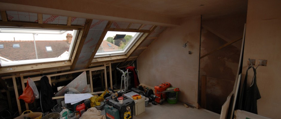 The bed will eventually butt up to the wall underneath the two VELUX windows inside this Barnes loft conversion