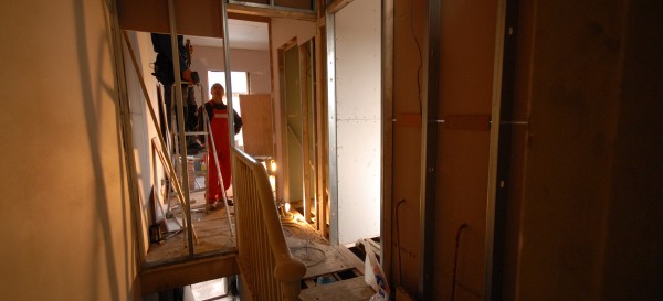 Fixing the new partitioning upstairs leading into the master bedroom and the two bathrooms