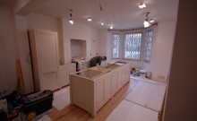 George fits the kitchen in Westcroft Square in Shepherds Bush (Note the wooden flooring has been fitted)