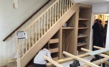Nick builds the storage cupboards and shelving under the stairs