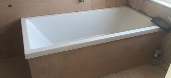 The old bath has been put back in place - we are now ready to fit the shower tray and to retile this bathroom in Fulham